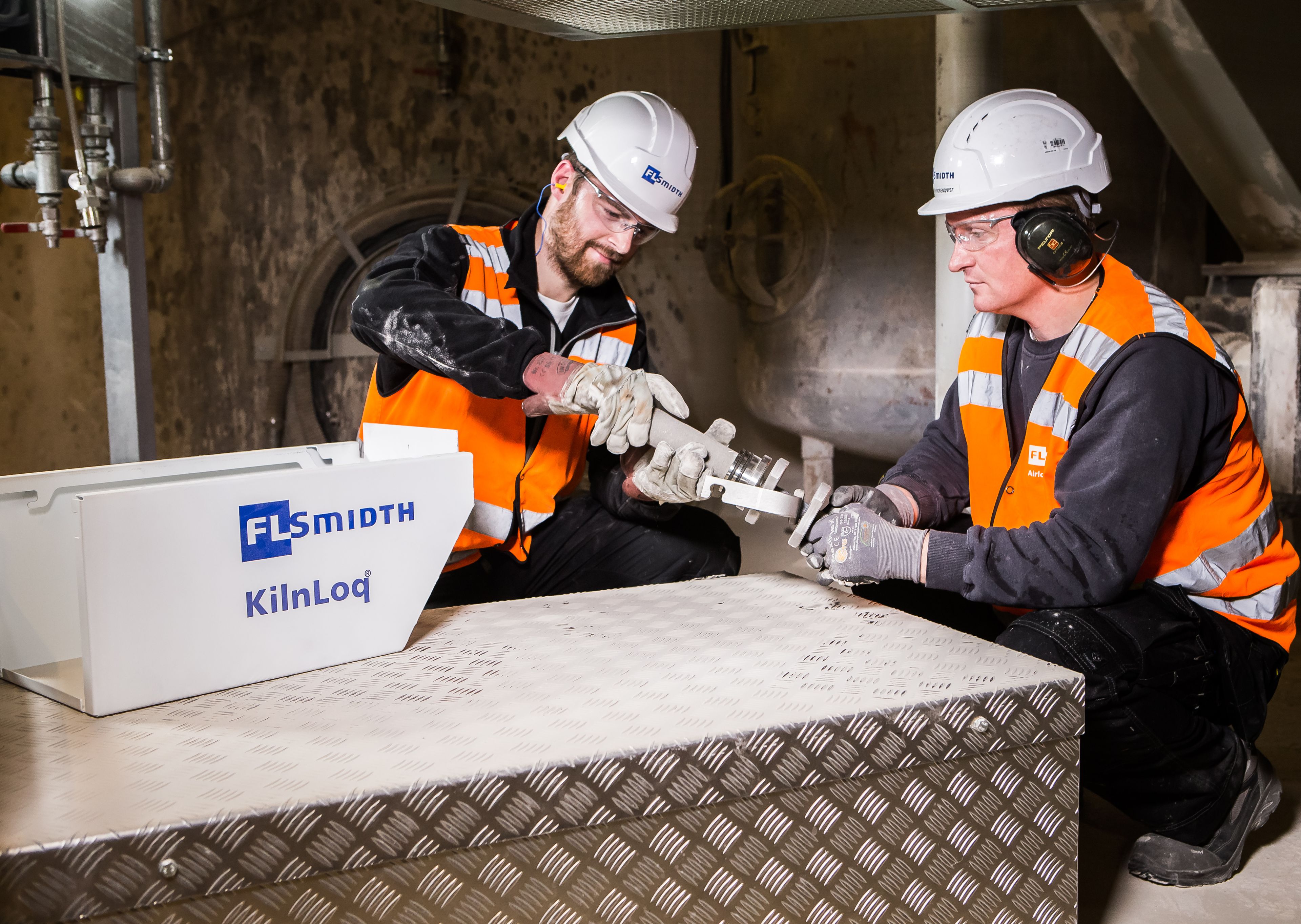 Two people working with kilnloq