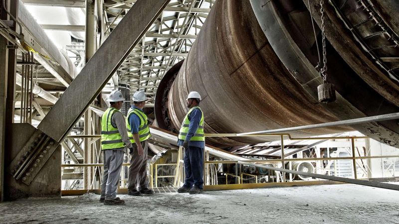 On-site team performing visual inspection of rotary kiln in cement production line