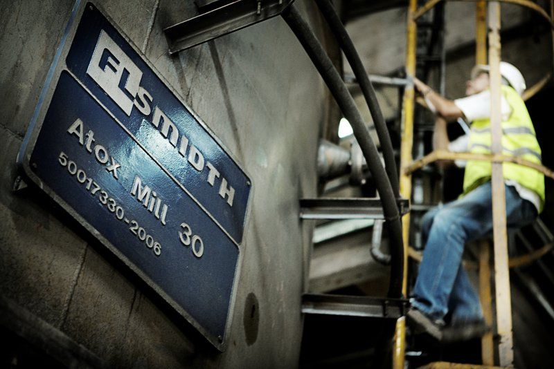 FLSmidth ATOX Mill 30 for raw material grinding in cement production with technician accessing equipment